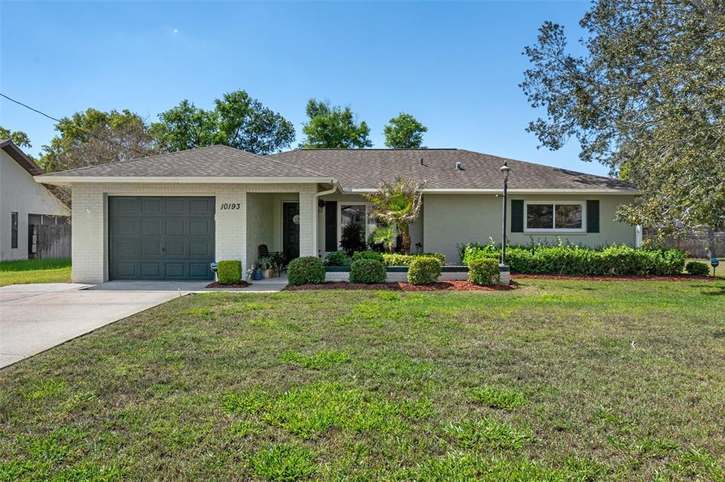 a house view with a garden space