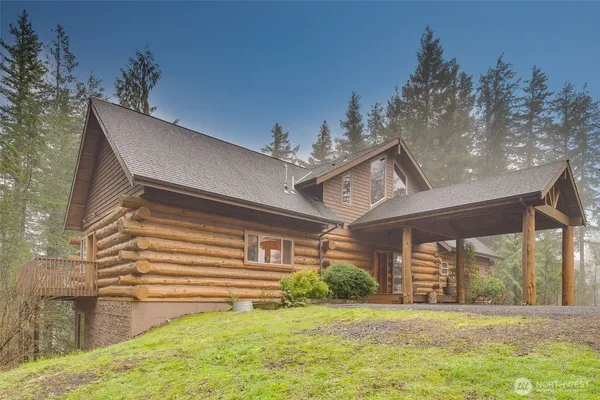 a view of a house with a yard and garage