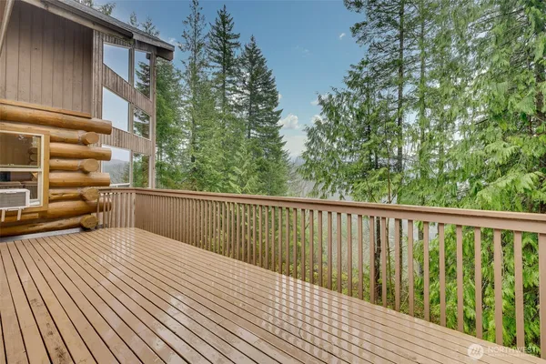 a balcony with trees in front of it