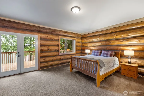 a bed room with a bed and a window