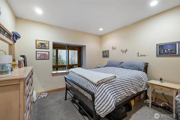 a bedroom with a bed and a desk
