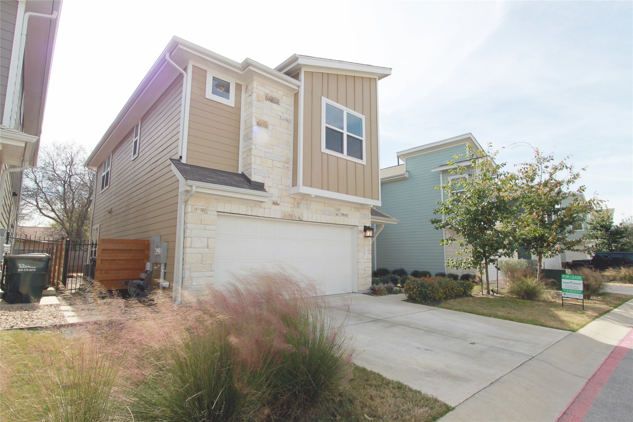 1507 Homespun Road Austin, TX 78745 - Photo 2 of 35 Modern two-story residence featuring a mixed-material facade with stone accents and horizontal siding