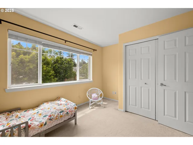 a bed room with a bed and a window