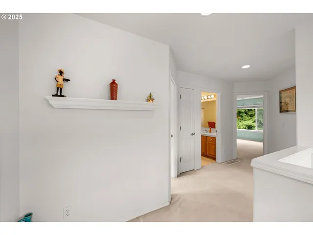 a view of kitchen with furniture and refrigerator