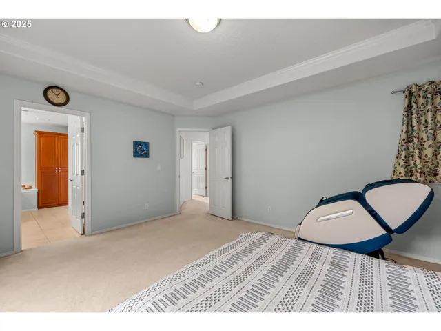 a bedroom with a bed and a chair