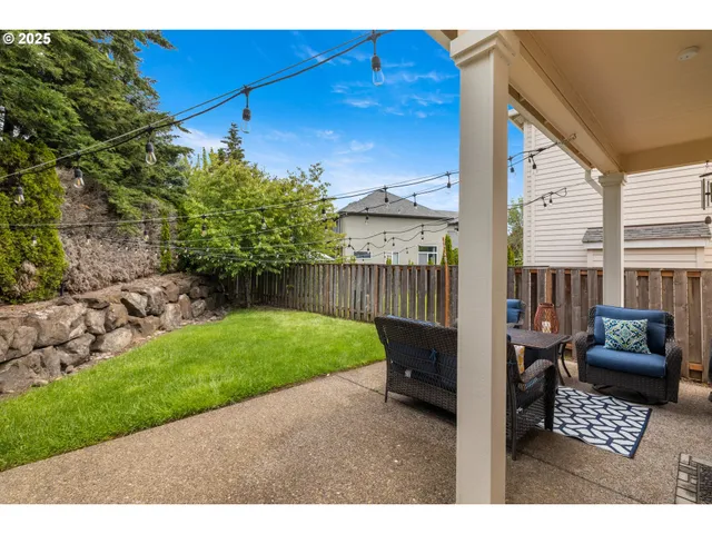 a balcony with furniture and a garden