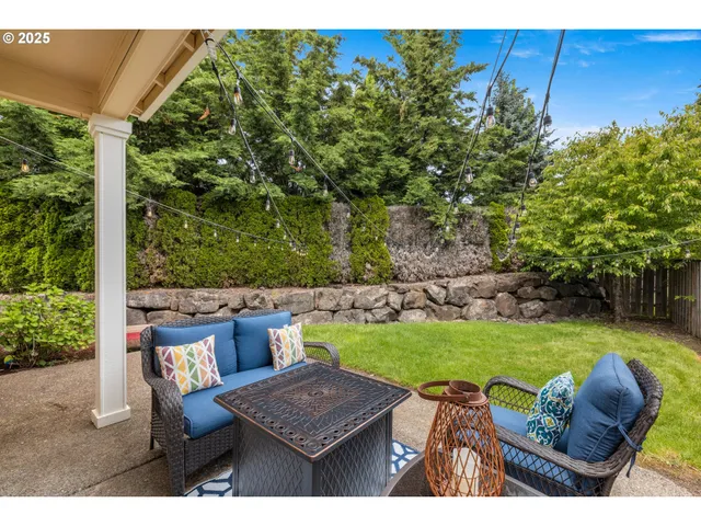 a view of outdoor sitting area with furniture and garden
