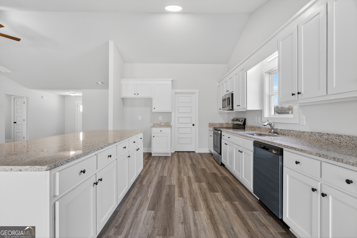 569 Liberty Hill Road, Unit 29 Hartwell, GA 30643 - Photo 12 of 46 a large kitchen with cabinets