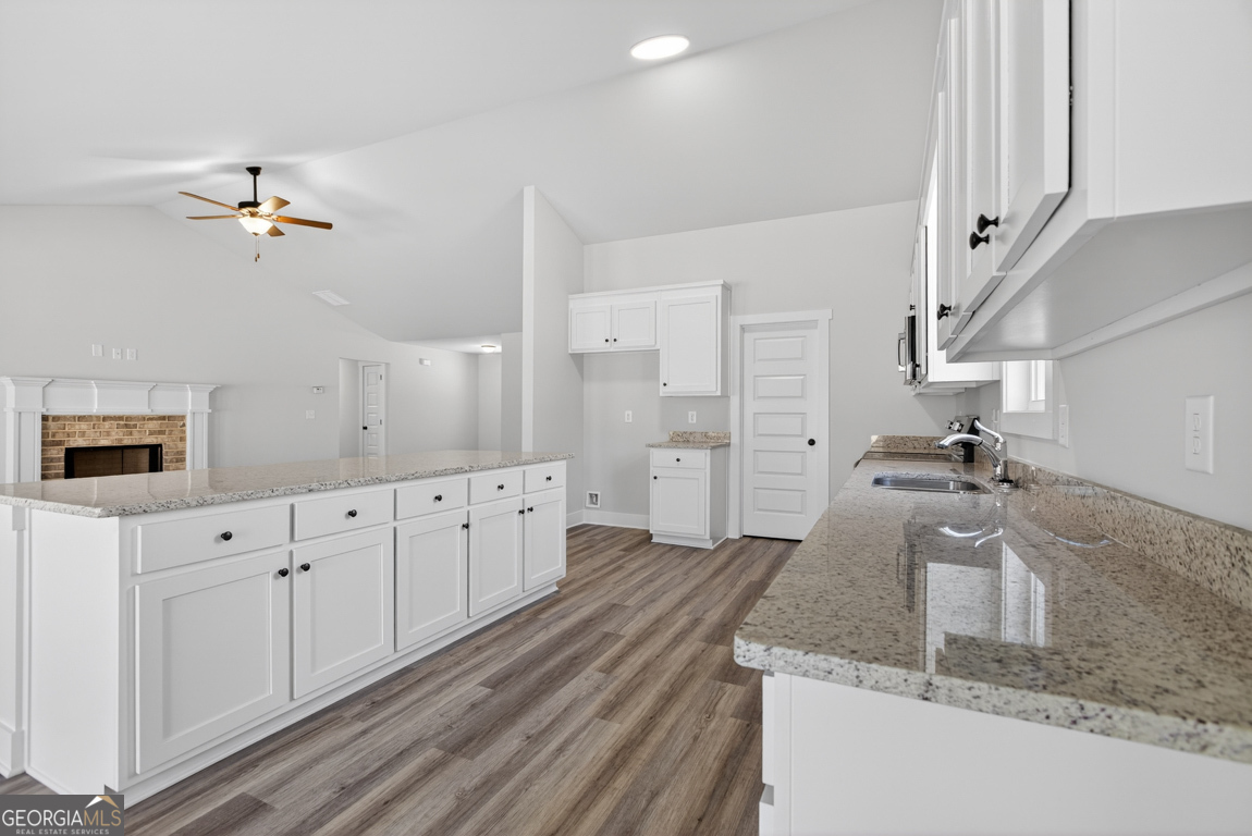 569 Liberty Hill Road, Unit 29 Hartwell, GA 30643 - Photo 13 of 46 a spacious bathroom with a granite countertop sink a mirror and shower