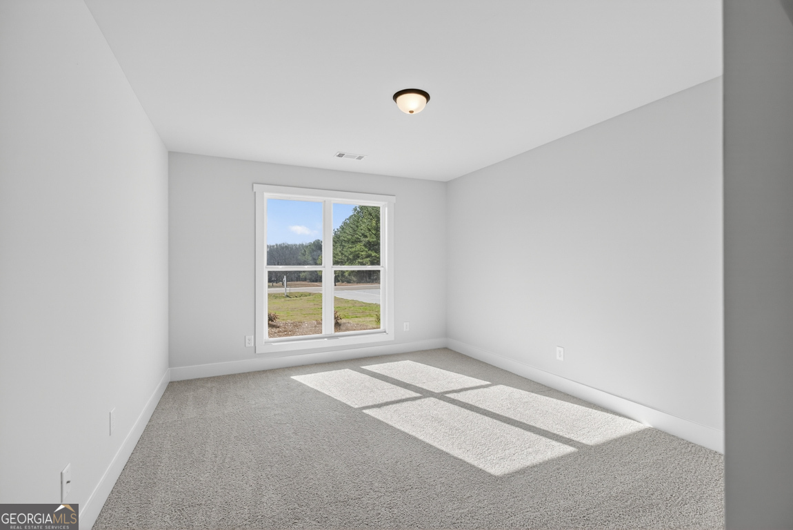 569 Liberty Hill Road, Unit 29 Hartwell, GA 30643 - Photo 23 of 46 a view of an empty room with a window