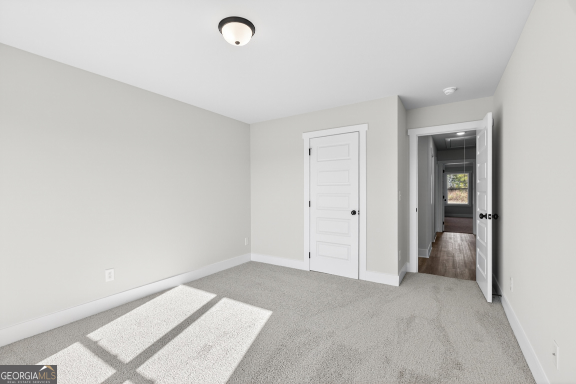 569 Liberty Hill Road, Unit 29 Hartwell, GA 30643 - Photo 24 of 46 an empty room with a natural light