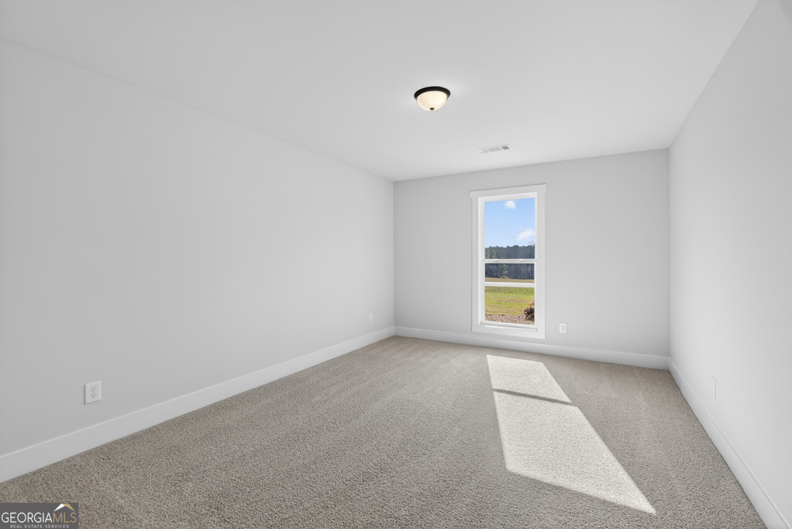 569 Liberty Hill Road, Unit 29 Hartwell, GA 30643 - Photo 26 of 46 an empty room with a window