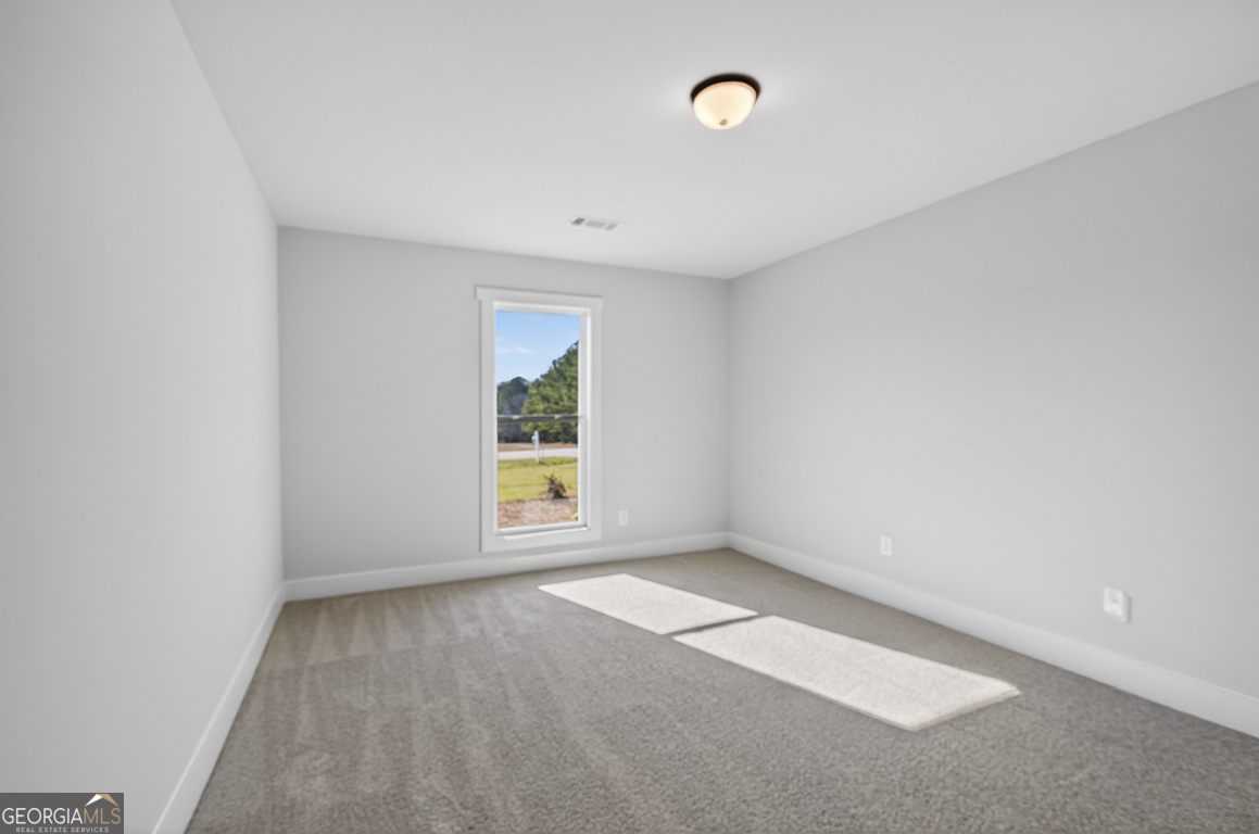 569 Liberty Hill Road, Unit 29 Hartwell, GA 30643 - Photo 27 of 46 an empty room with windows