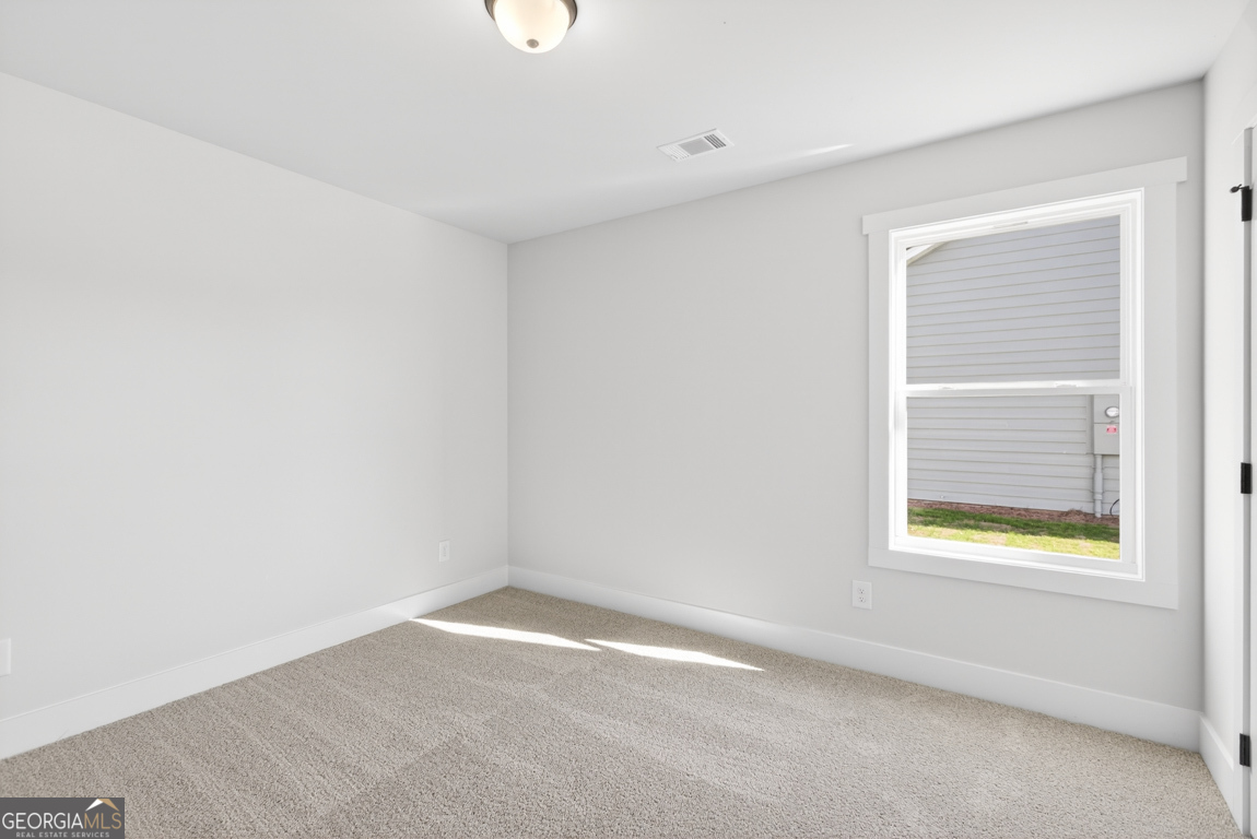 569 Liberty Hill Road, Unit 29 Hartwell, GA 30643 - Photo 29 of 46 an empty room with a window