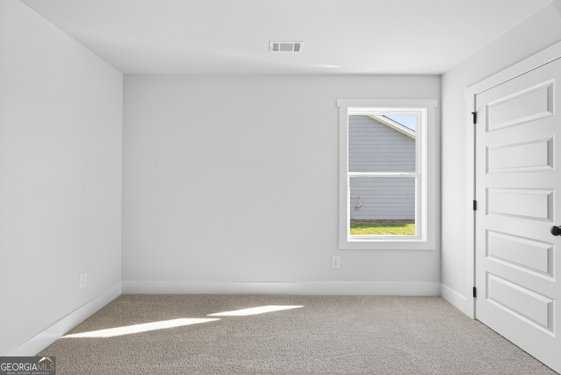 569 Liberty Hill Road, Unit 29 Hartwell, GA 30643 - Photo 30 of 46 an empty room with a window