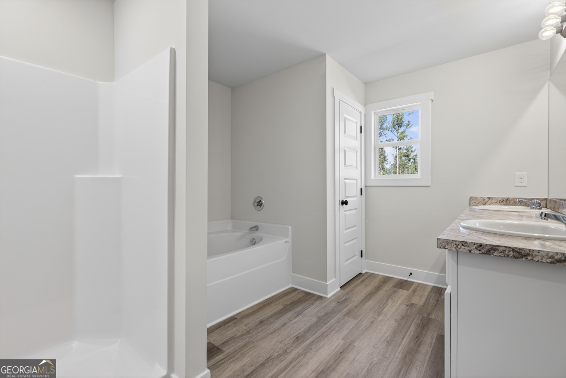 569 Liberty Hill Road, Unit 29 Hartwell, GA 30643 - Photo 40 of 46 a bath room with a sink and a bath tub