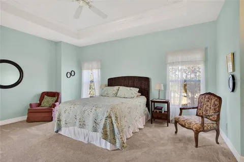 a bedroom with a bed and a couch