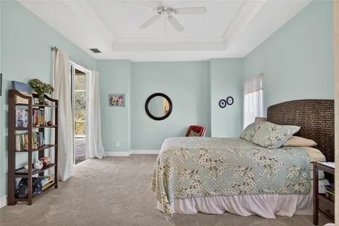 a bedroom with a bed and a book shelf