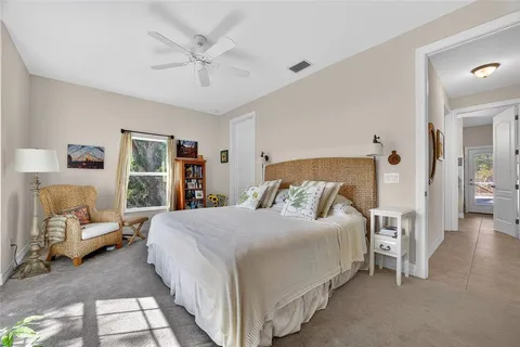 a bedroom with a bed and a walk in closet