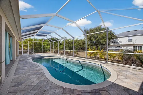 a view of a swimming pool with a lounge chairs