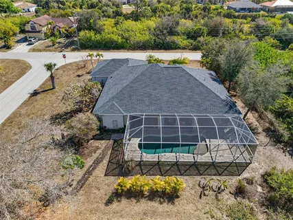a view of a swimming pool with a lounge chairs