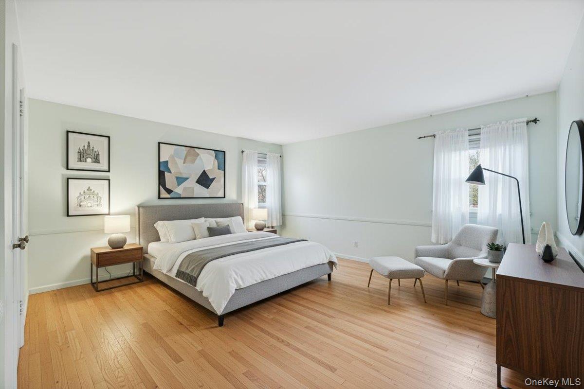 816 Pepperidge Road Westbury, NY 11590 - Photo 11 of 22 a bedroom with a bed and a couch