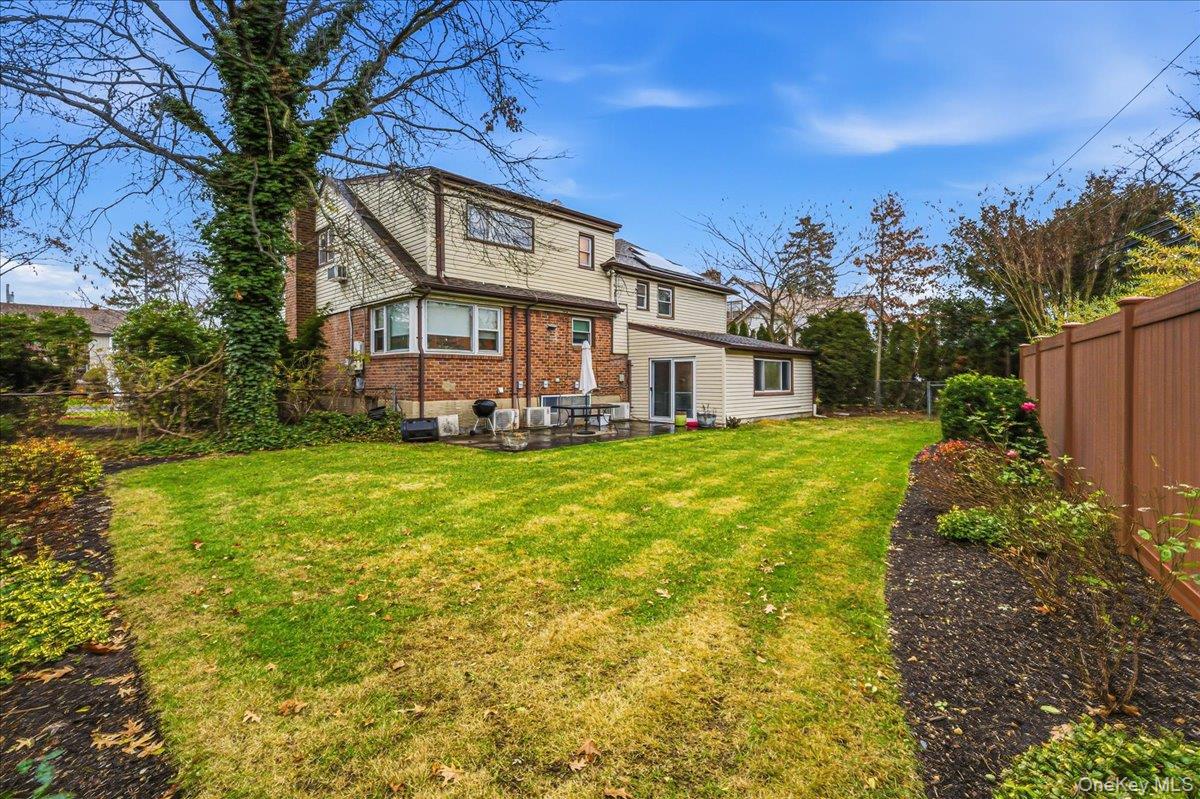 816 Pepperidge Road Westbury, NY 11590 - Photo 16 of 22 a view of a house with a big yard