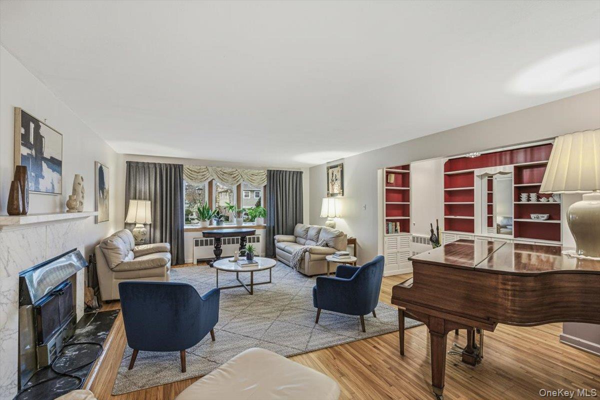 816 Pepperidge Road Westbury, NY 11590 - Photo 5 of 22 a living room with furniture and a window