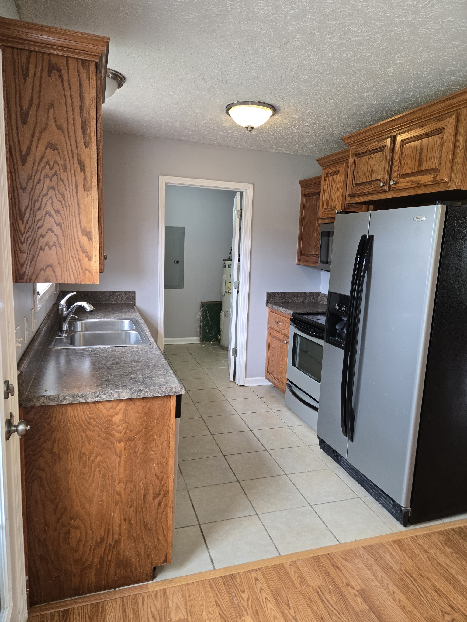 180 Shaub Road Portland, TN 37148 - Photo 10 of 19 a kitchen with a refrigerator and a sink
