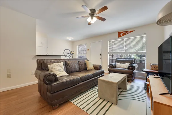 a living room with furniture or couch and a flat screen tv