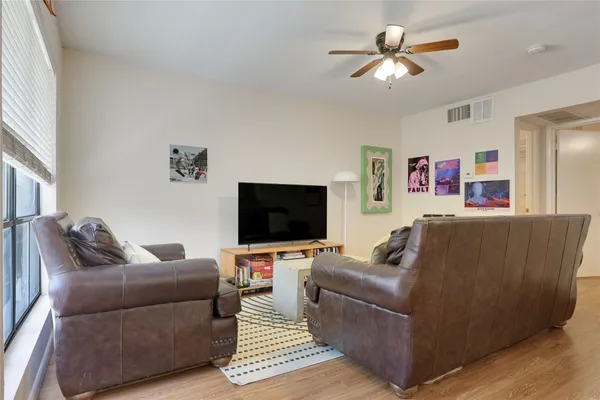 a kitchen with stainless steel appliances granite countertop a stove and a wooden floors