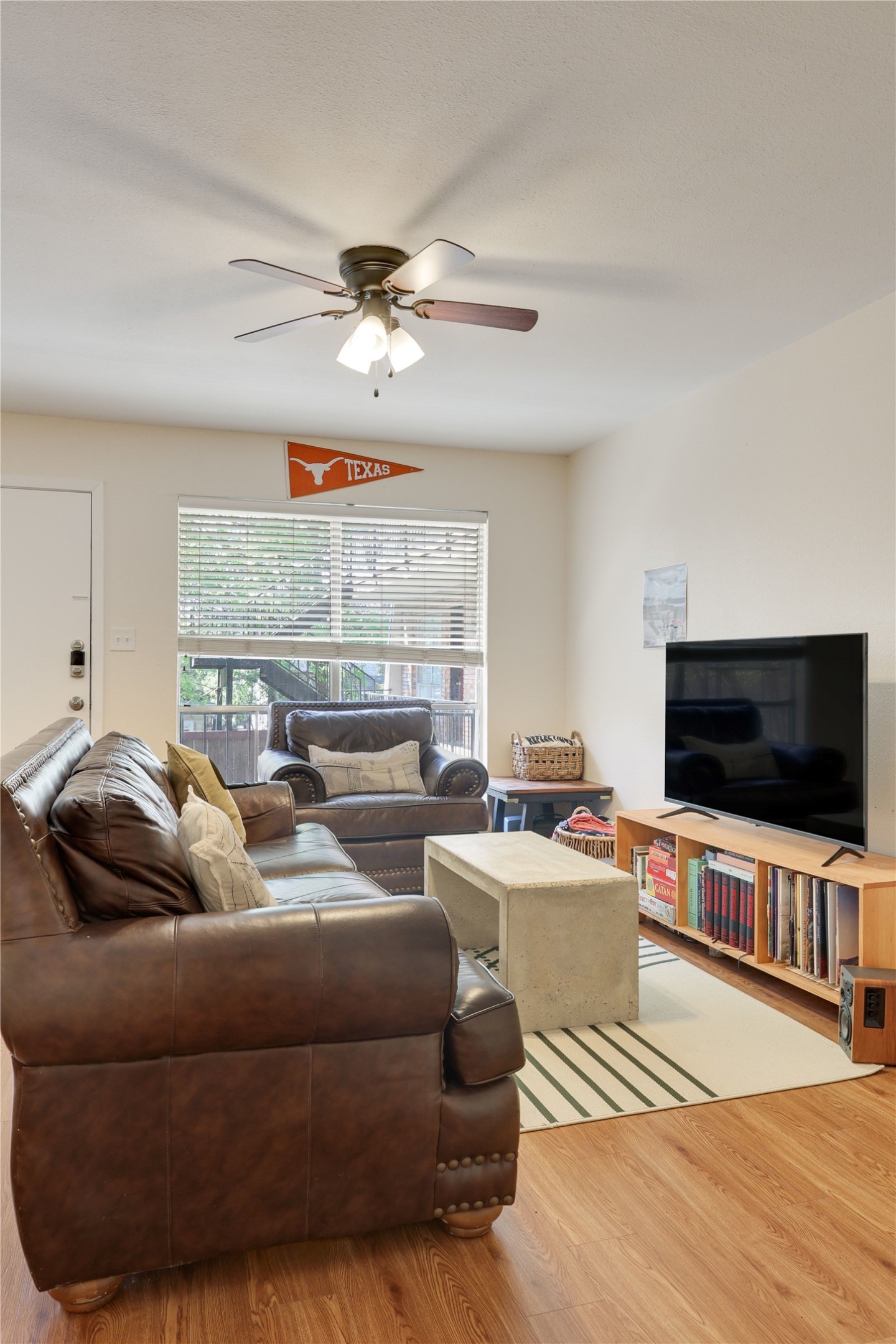 2207 Leon Street, Unit 204 Austin, TX 78705 - Photo 3 of 19 a living room with furniture and a flat screen tv