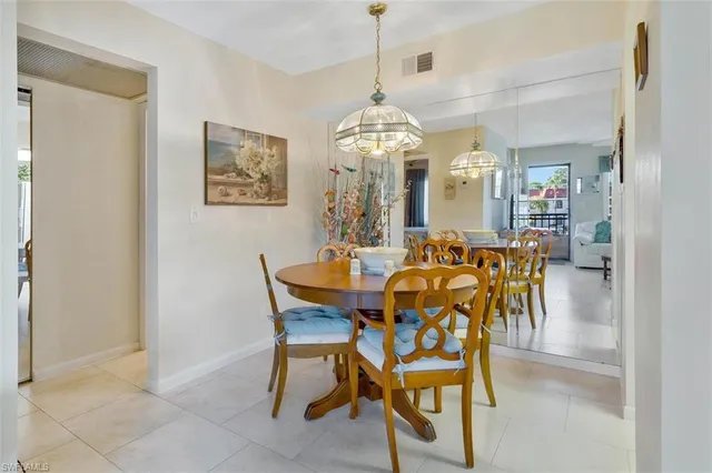 a kitchen with stainless steel appliances kitchen island granite countertop a refrigerator and microwave