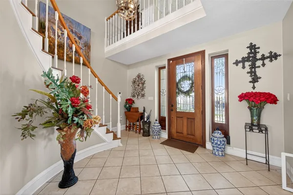 a vase of flowers sitting on a floor