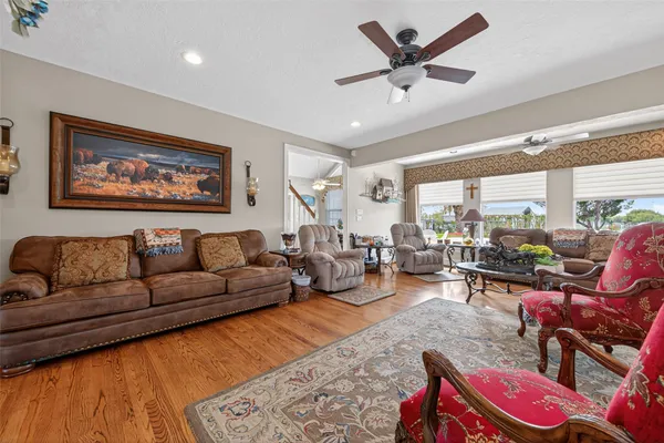 a living room with furniture or couch and a large window