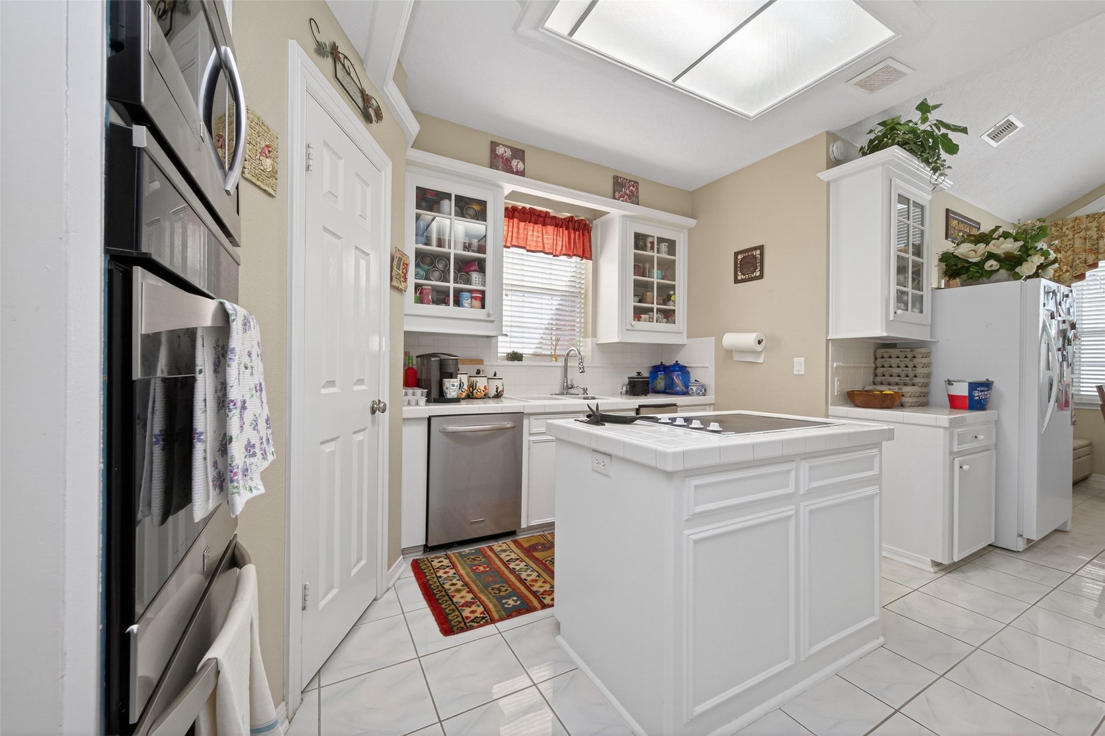 1608 Krenek Road Crosby, TX 77532 - Photo 17 of 49 a kitchen with cabinets appliances and a counter top space