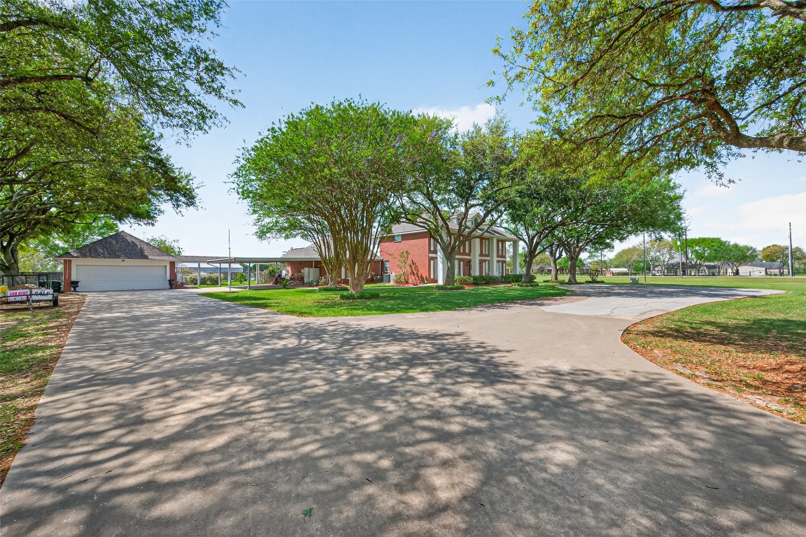 1608 Krenek Road Crosby, TX 77532 - Photo 3 of 49 a view of outdoor space with garden and trees