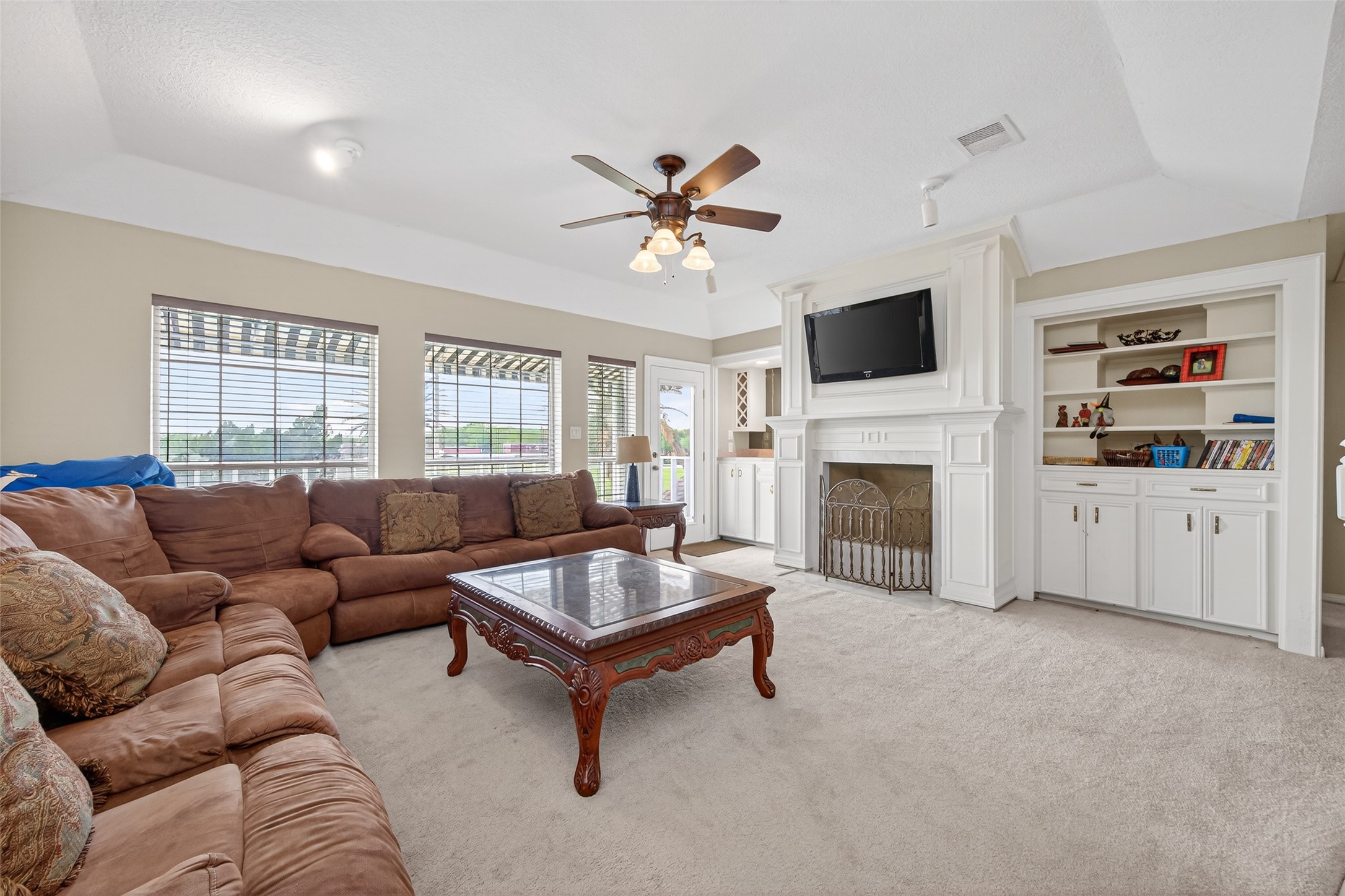 1608 Krenek Road Crosby, TX 77532 - Photo 34 of 49 a living room with furniture a fireplace and a flat screen tv