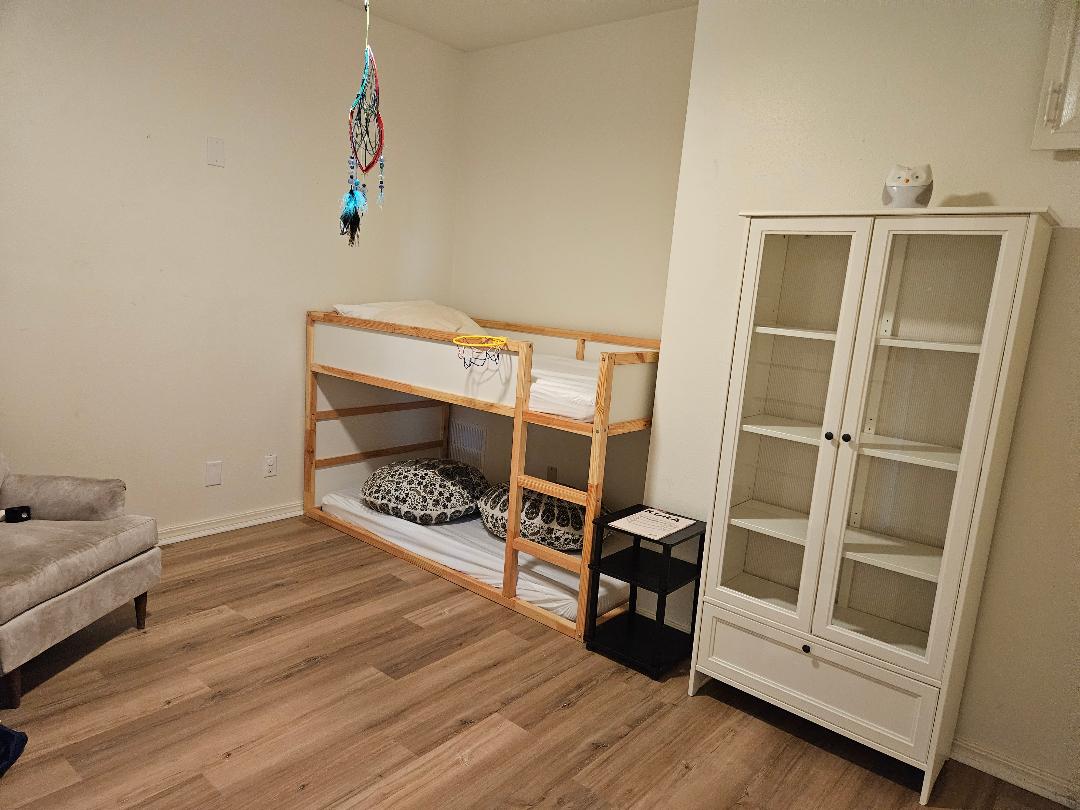 710 North Avenue C Elgin, TX 78621 - Photo 19 of 33 a bedroom with furniture and a window