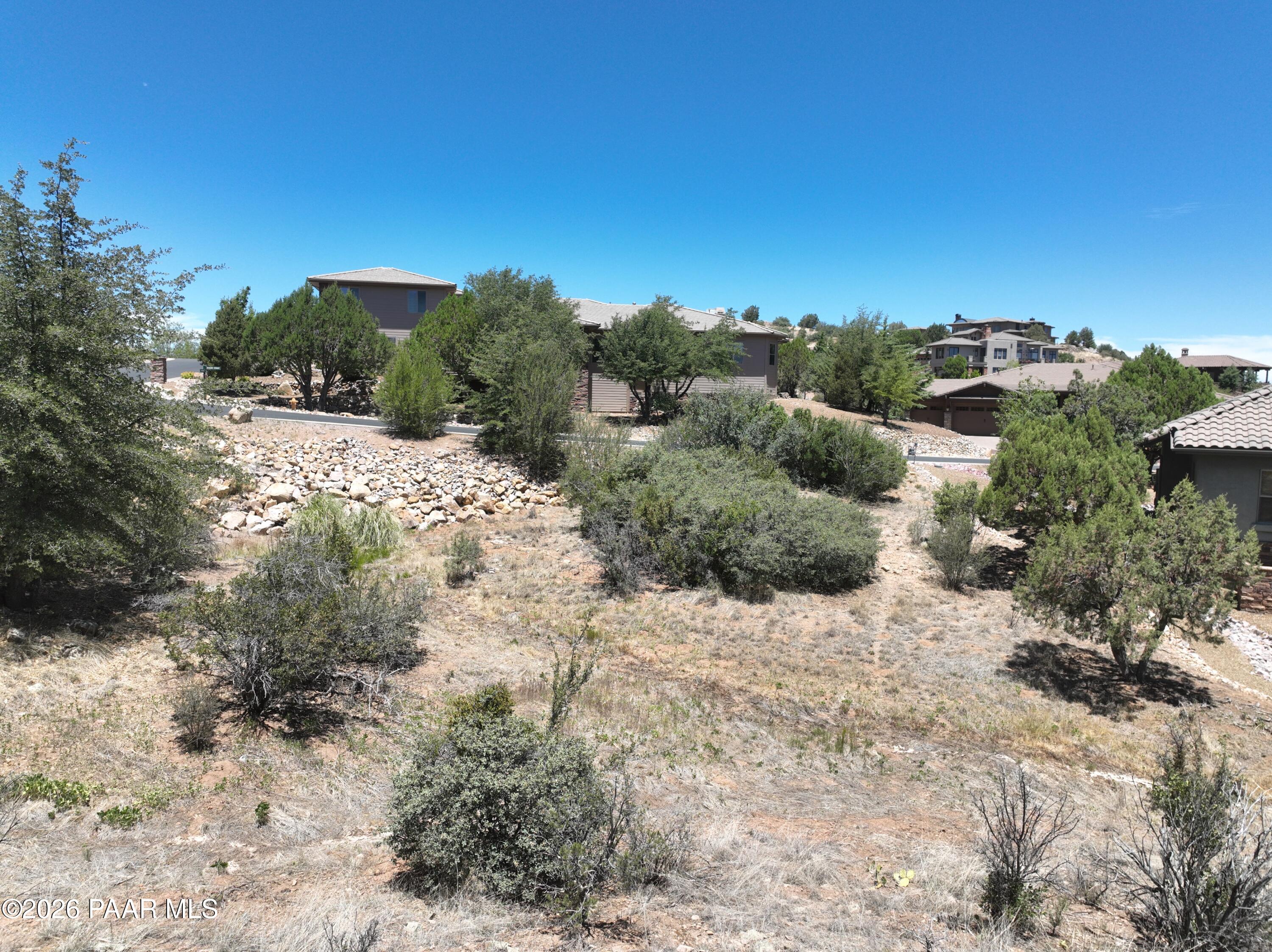 1425 Short Point Lane Prescott, AZ 86305 - Photo 14 of 15 a view of a dry yard with lots of green space and fog