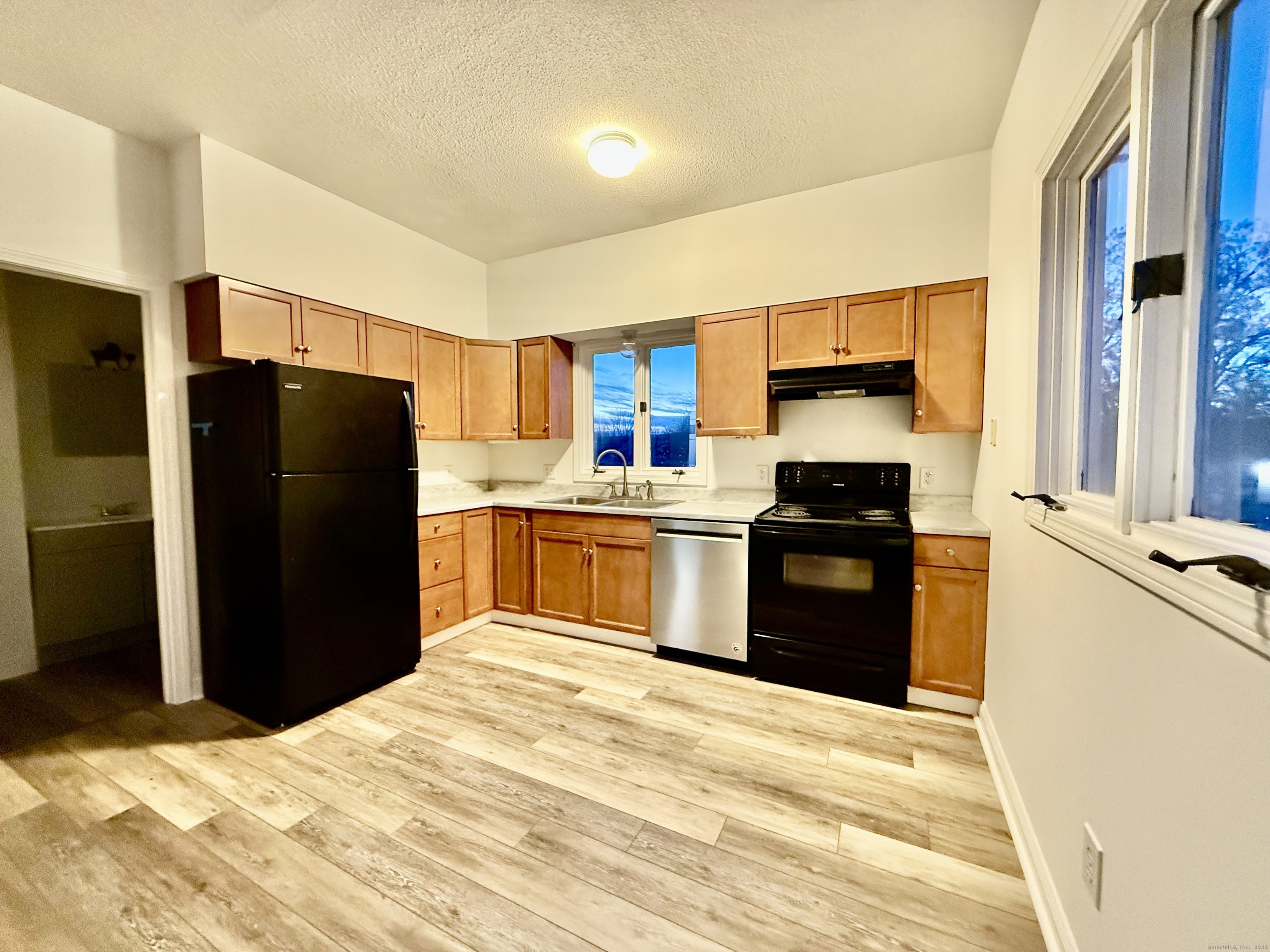 141 East High Street East Hampton, CT 06424 - Photo 4 of 17 a kitchen with a refrigerator and a sink