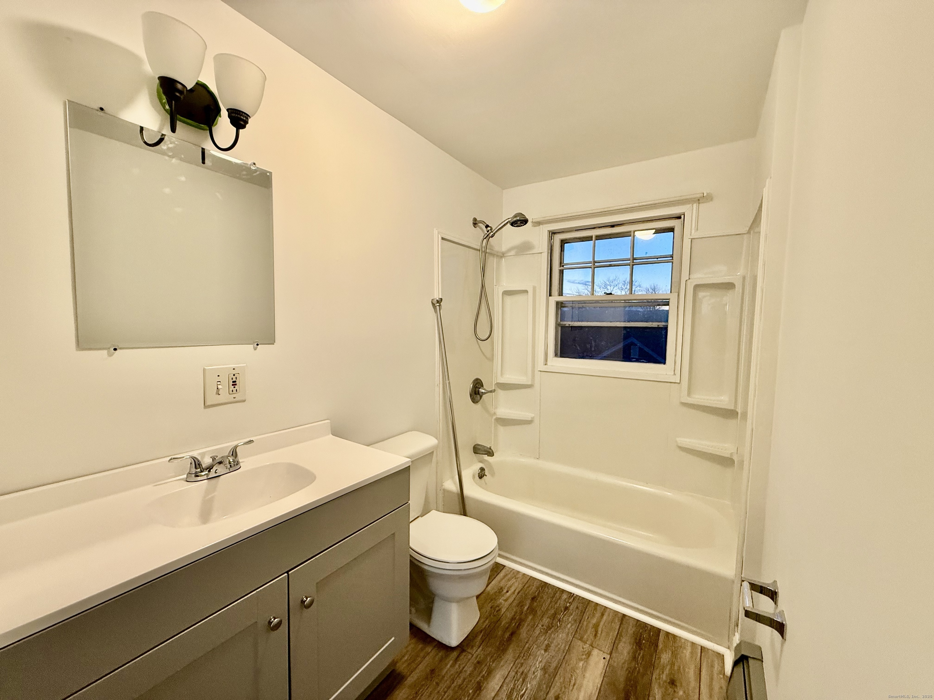 141 East High Street East Hampton, CT 06424 - Photo 6 of 17 a bathroom with a granite countertop sink toilet and shower