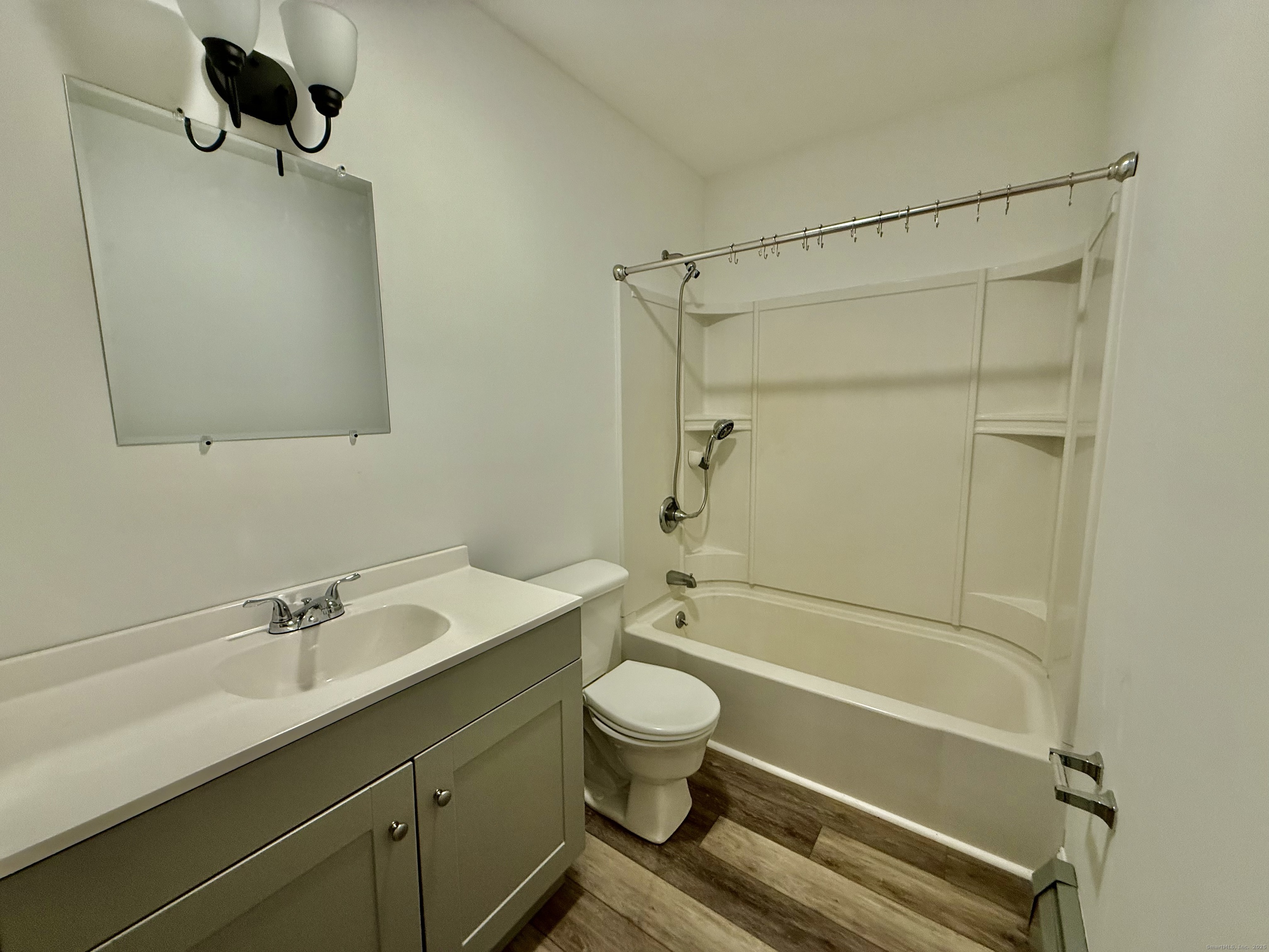 141 East High Street East Hampton, CT 06424 - Photo 7 of 17 a bathroom with a sink a toilet and shower