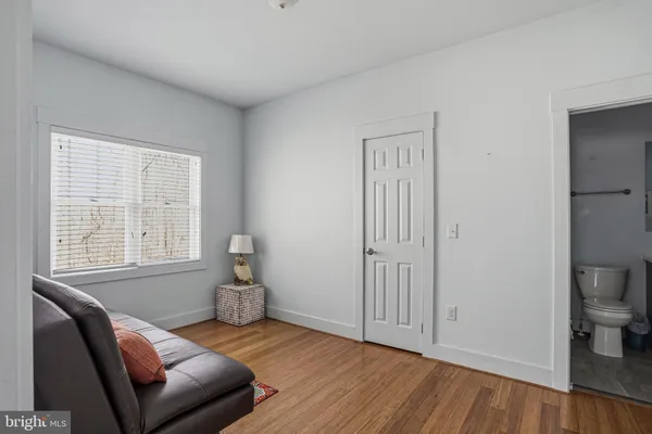 a bed room with a bed and a book shelf