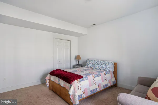 a bathroom with a toilet a sink and a mirror