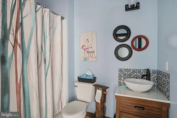 a living room with furniture and a rug