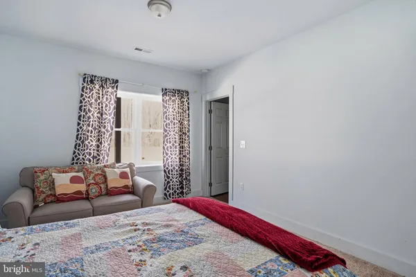 a view of swimming pool with a yard and large trees