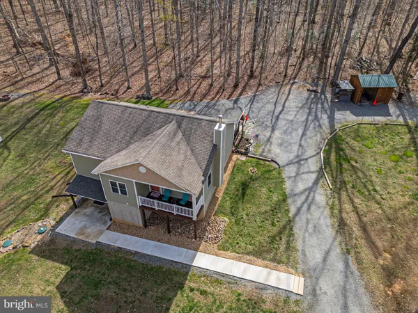 an aerial view of a house having yard