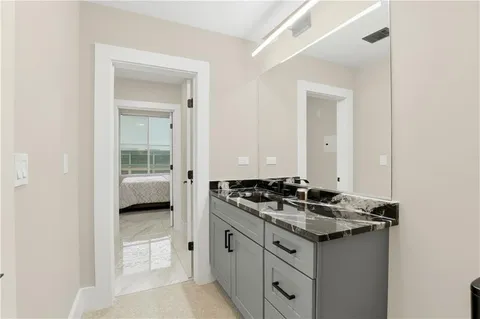a kitchen with sink and cabinets