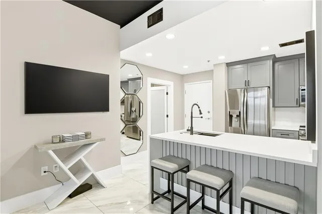 a livingroom with furniture and a flat screen tv